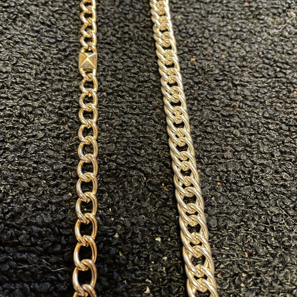 Goldish toned and silver toned chains